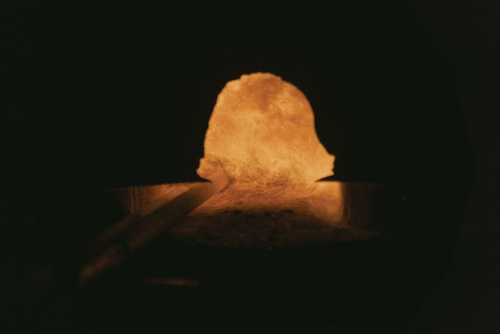 Close-up view of a blacksmith's forge, showcasing the fiery interior and intense heat.
